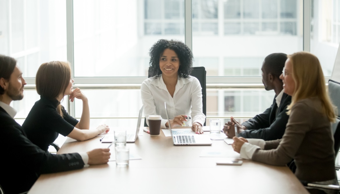 young African American female executive meeting with her team 