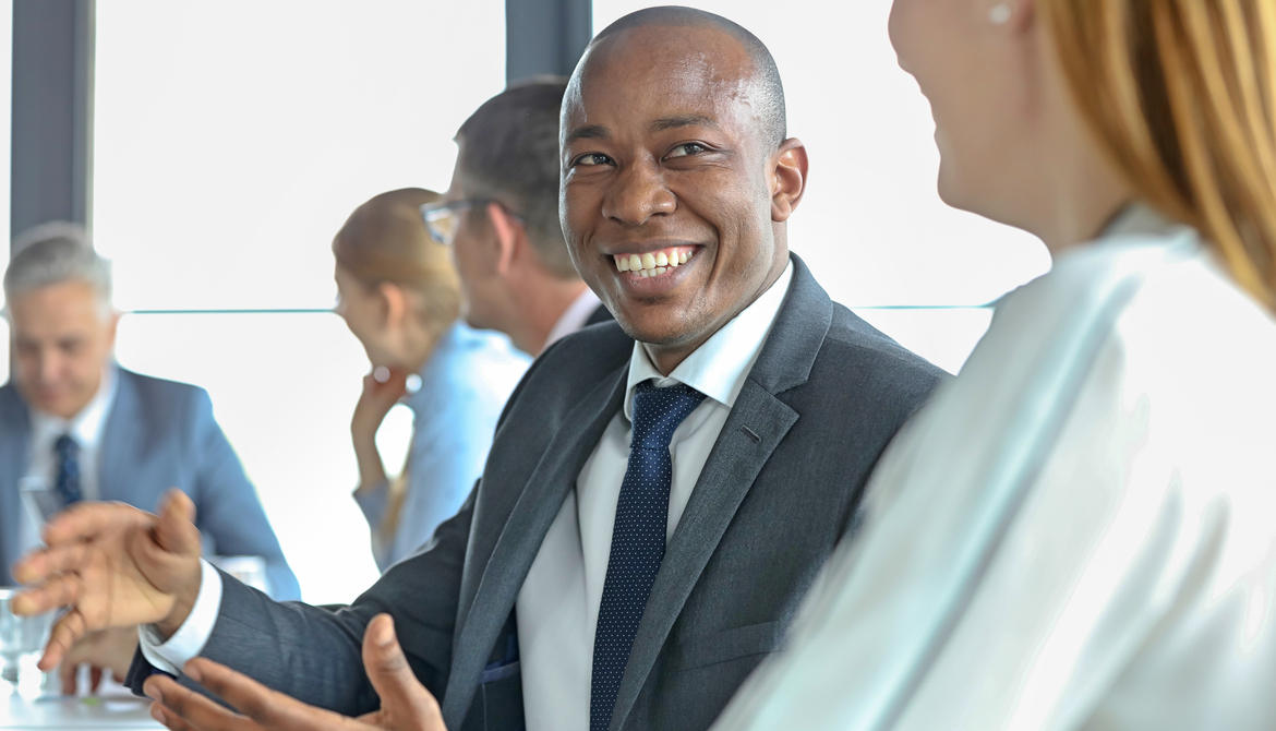 african american board member talks with another director