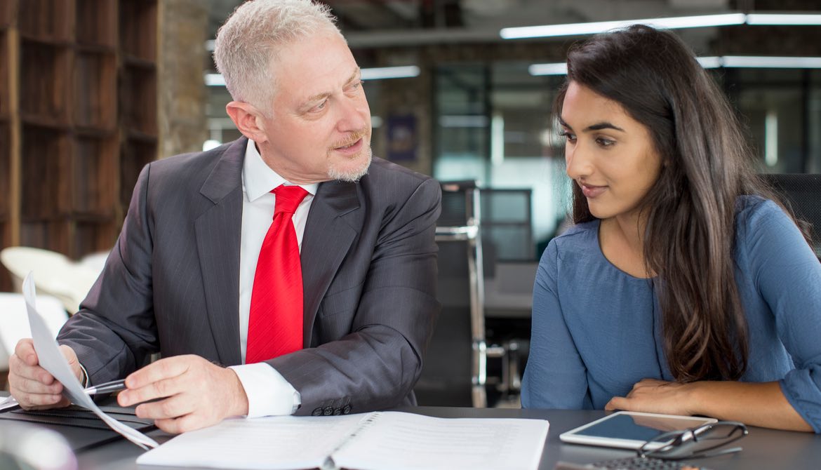 male executive serving as a mentor to a younger female executive