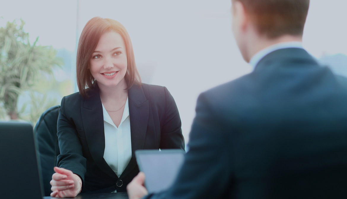 young female executive getting advice from a colleague