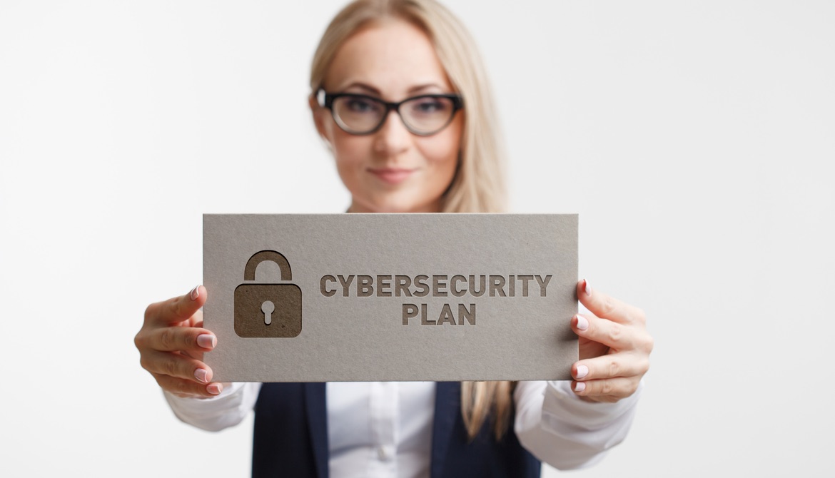 cybersecurity plan sign held by woman