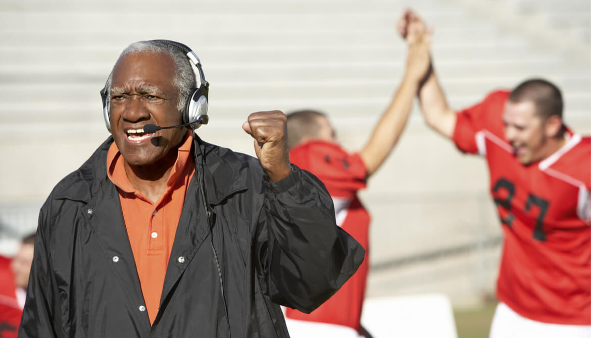 football coach pumping fist