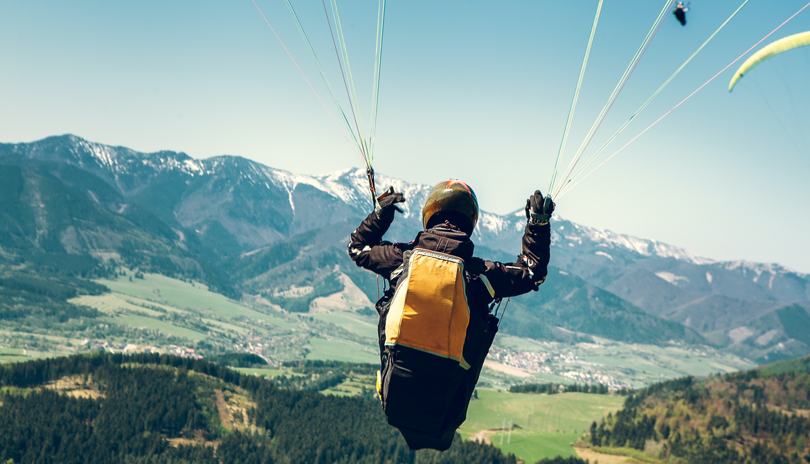 Paraglider is on the paraplane strops