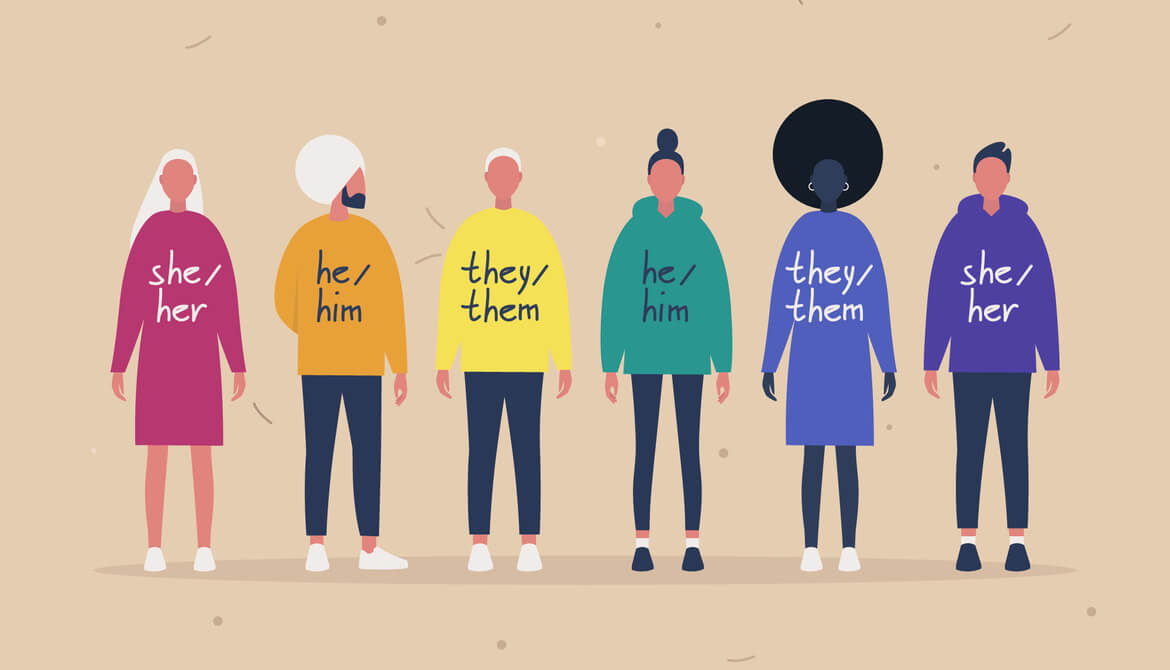 diverse lineup of people wearing sweaters with a variety of pronouns on them