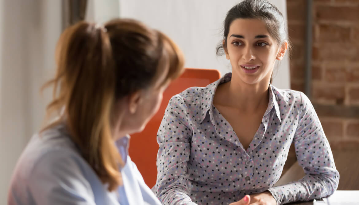 new young female manager coaching female employee