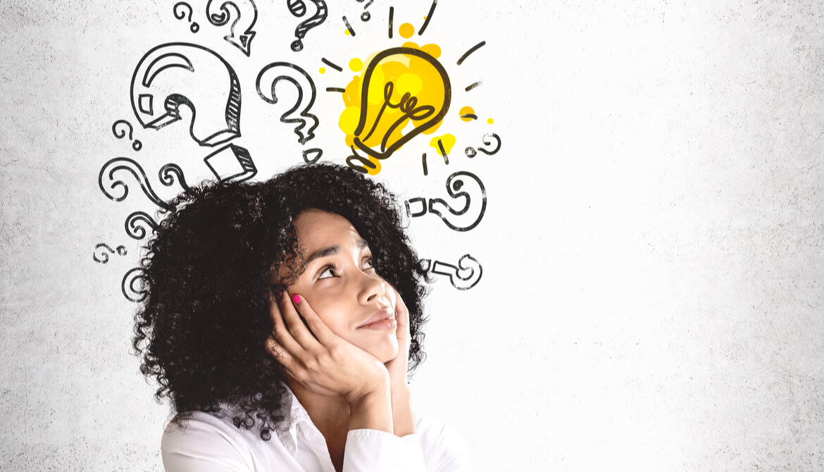 Black woman with questions marks and a light bulb over her head on an orange background