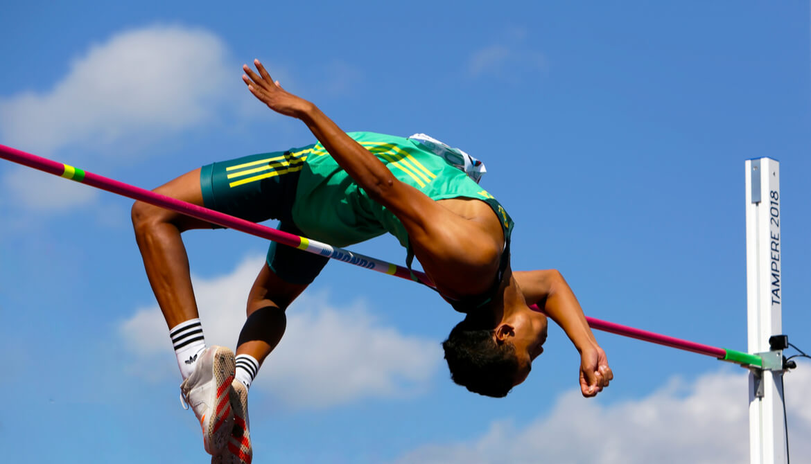 high jumper clears the bar