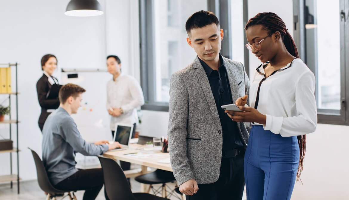 Manager discussing assignment with high-performing employee team member