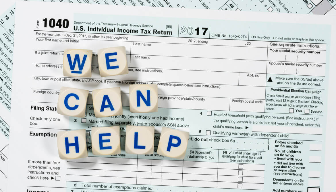 1040 tax form with blocks spelling out we can help