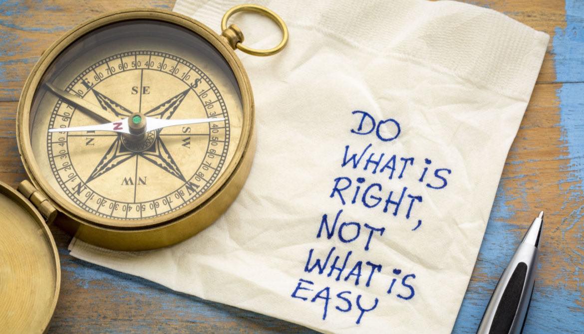 compass with napkin and writing saying do the right thing