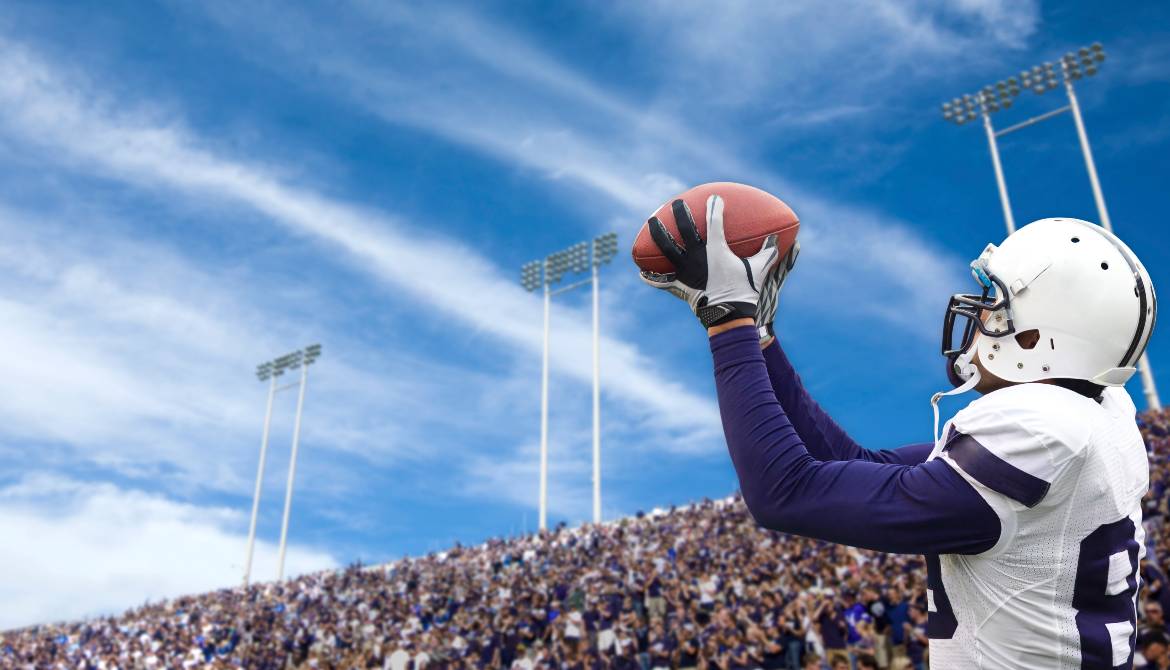 football player catching a long pass