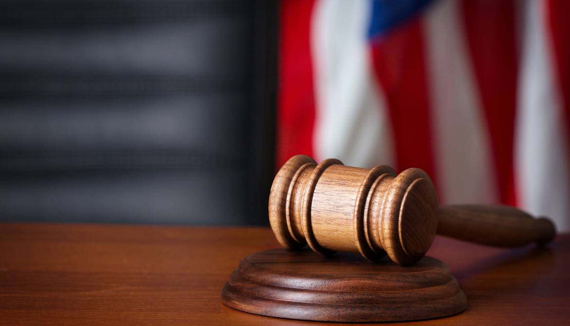 gavel on a court desk with flag