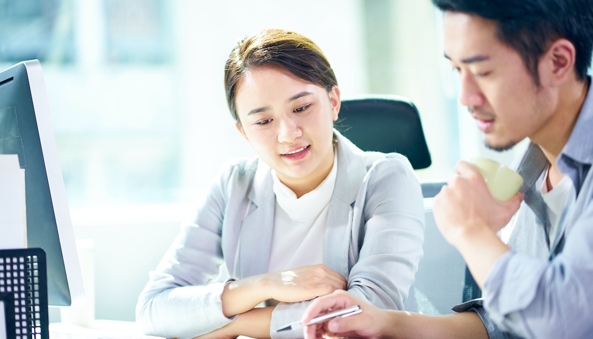 manager discussing performance evaluation with employee team member