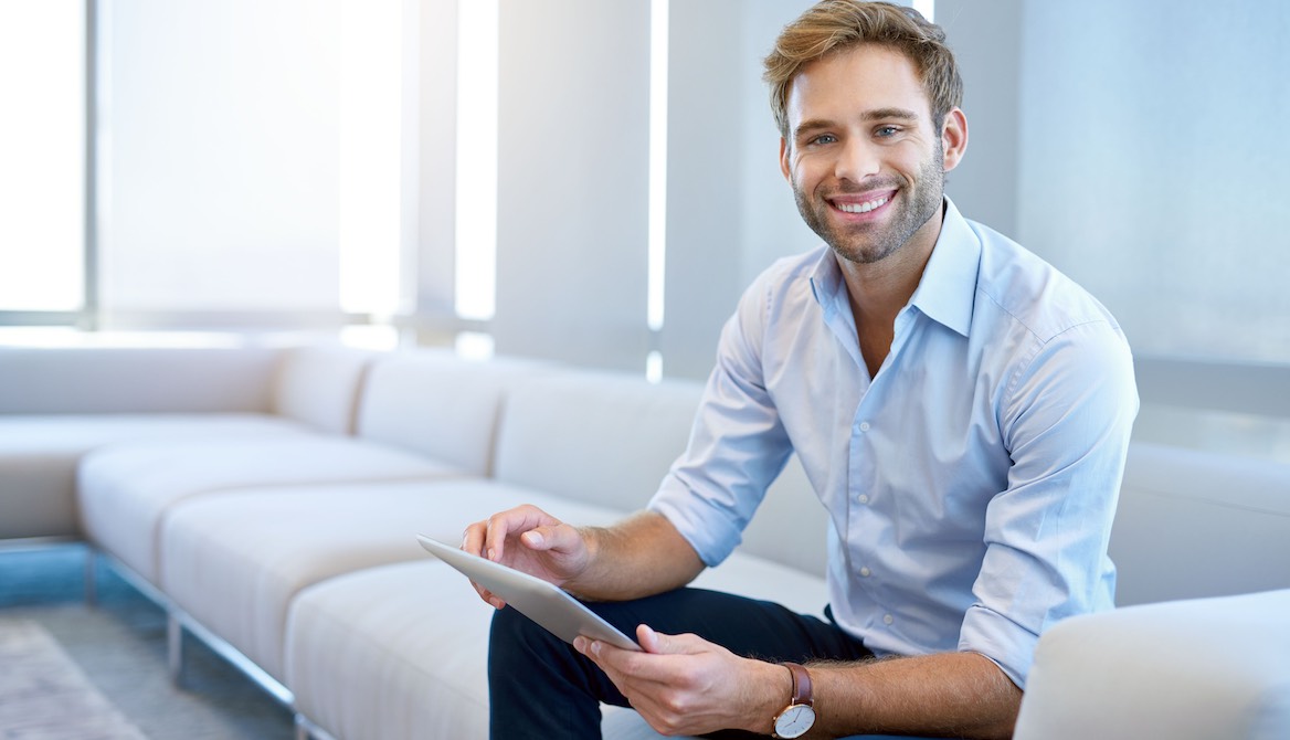 executive with ipad on couch