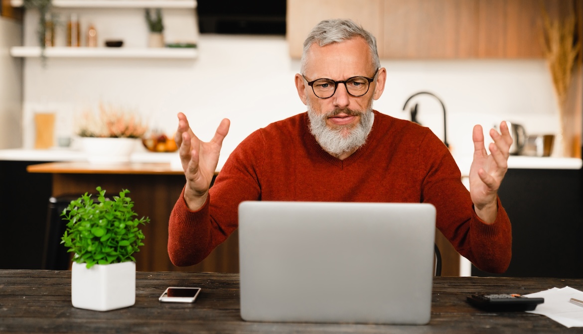 man laptop surprise kitchen