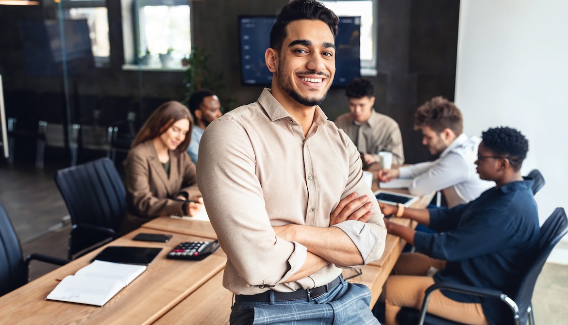 young businessman leads team of productive employees in the office