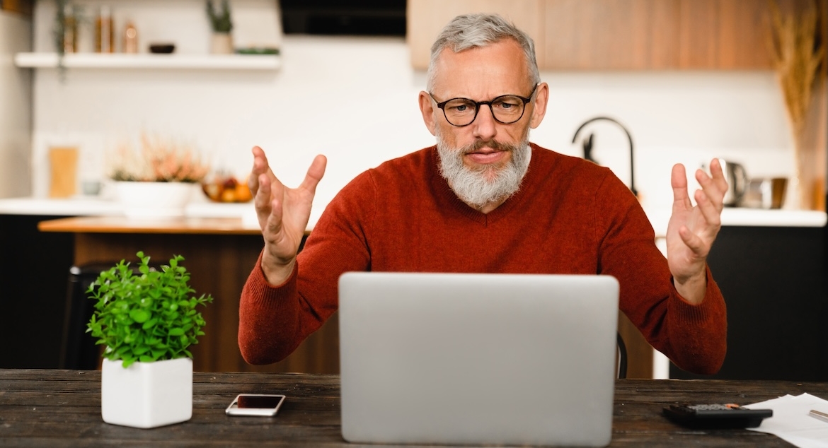 man laptop surprise kitchen