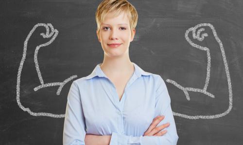 Businesswoman with illustration of big muscles denoting power