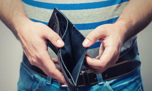 man holding open an empty wallet