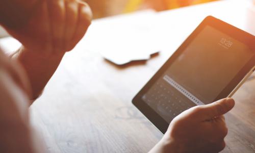 Director logging into board portal on a tablet