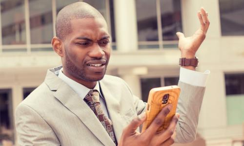 HR professional looking offended at phone