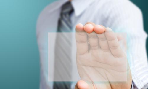 man holding up transparent screen