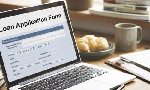 empty loan application form displaying on a laptop screen
