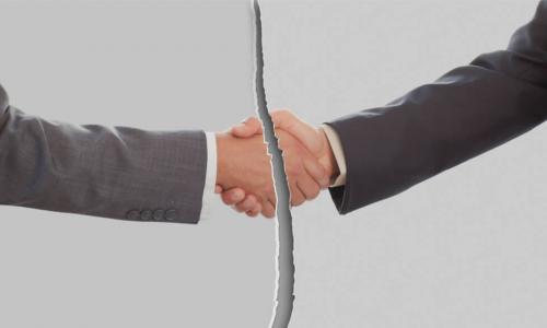 broken or torn image of businessmen shaking hands