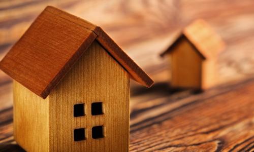 wooden house on a wooden table