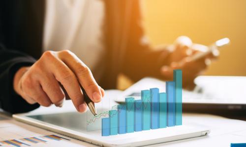 executive auditing with tablet displaying a 3-D chart