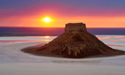 sun rising behind Ustyurt Plateau in central Asia