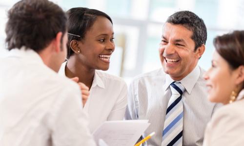 diverse team laughing together