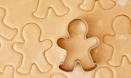 gingerbread man cutter making cookies