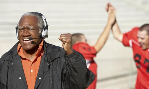 football coach pumping fist