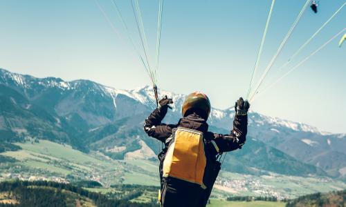 Paraglider is on the paraplane strops