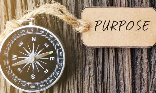 compass with tag that says purpose