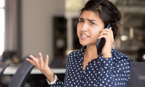 unhappy woman on the phone