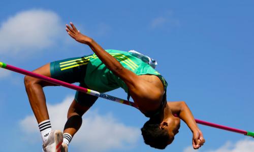 high jumper clears the bar