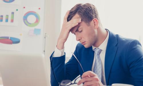 businessman burned out laptop coffee