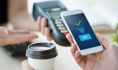 paying for coffee with contactless option using smartphone