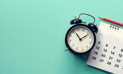 calendar and clock with pencil