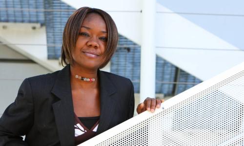 African-American business woman standing on the stairs