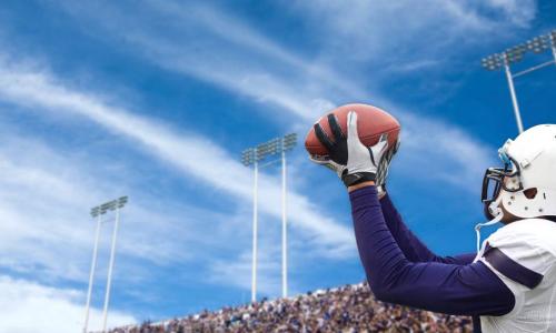 football player catching a long pass