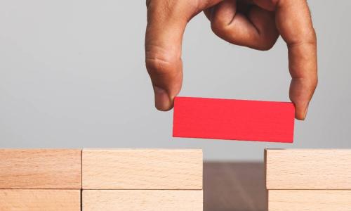 red wooden block between the gap