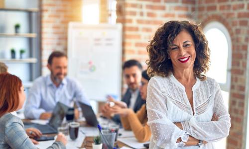 mature leader at meeting table